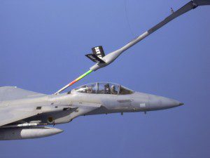 Cameraman Manuel Villeala shoots video of air-to-air refueling from backseat of an F-15 fighter during an Operation Noble Eagle mission following the September 11 terrorist attacks. Photo by Robert Riggs