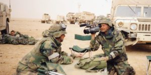 Robert Riggs reporting from Iraq during the Invasion in 2003. Pictured here with cameraman Billy Sexton with a Patriot Missile Battery from 552ADA